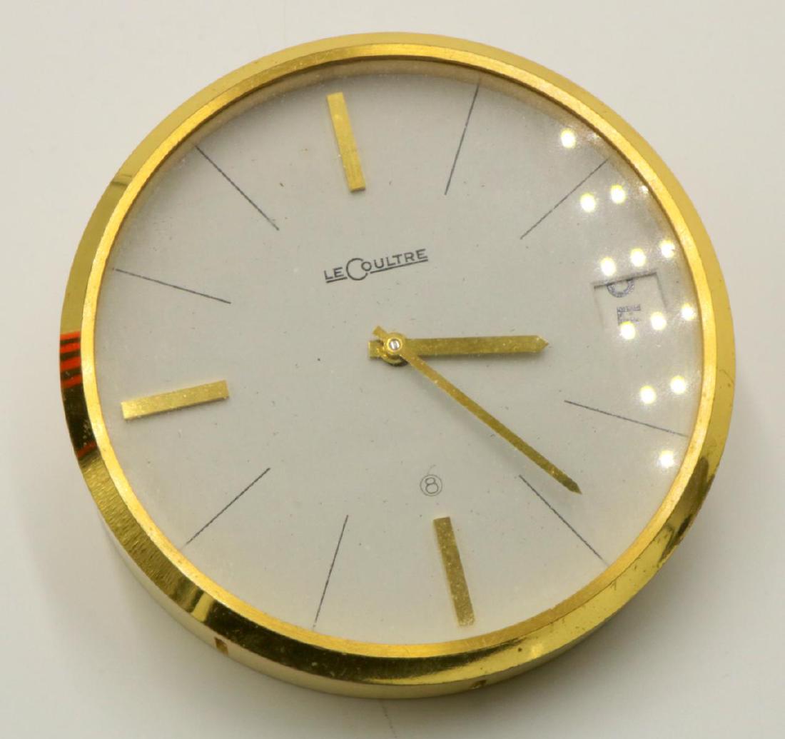 Le Coultre Brass Desk Clock: Le Coultre Brass Desk Clock. Measures - 1 3/4" high x 3 7/8" diameter.