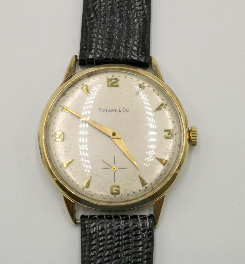 Vintage Tiffany & Co. 14Kt Watch: Vintage Tiffany & Co. 14Kt Yellow Gold Watch, with Black leather band. With Movado movement. Measures - 9 1/4" long.