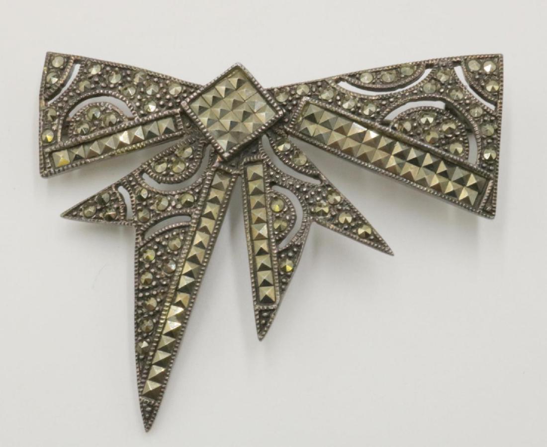 Marcasite & Sterling Bow Brooch: Marcasite & Sterling Silver Bow Brooch. Measures - 2 3/8" wide. Weight - 16.6 grams.