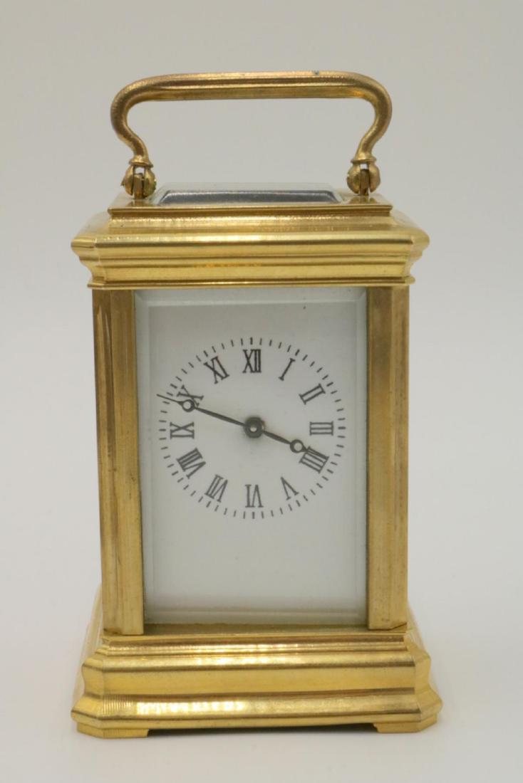 Vintage Miniature Brass Key Wind Carriage Clock: Vintage Miniature Brass Key Wind Carriage Clock. Measures - 3" high.