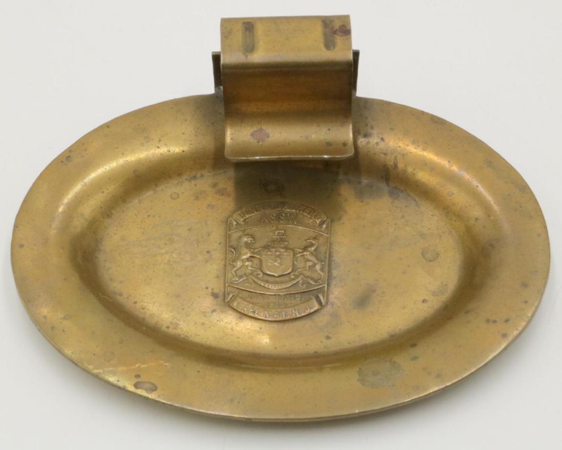 Vintage 1915 Penna Bankers ASSN Brass Cigar Ashtray: Vintage 1915 Penna Bankers ASSN Brass Cigar Ashtray. Measures - 1 3/4" high x 5 3/8" wide.