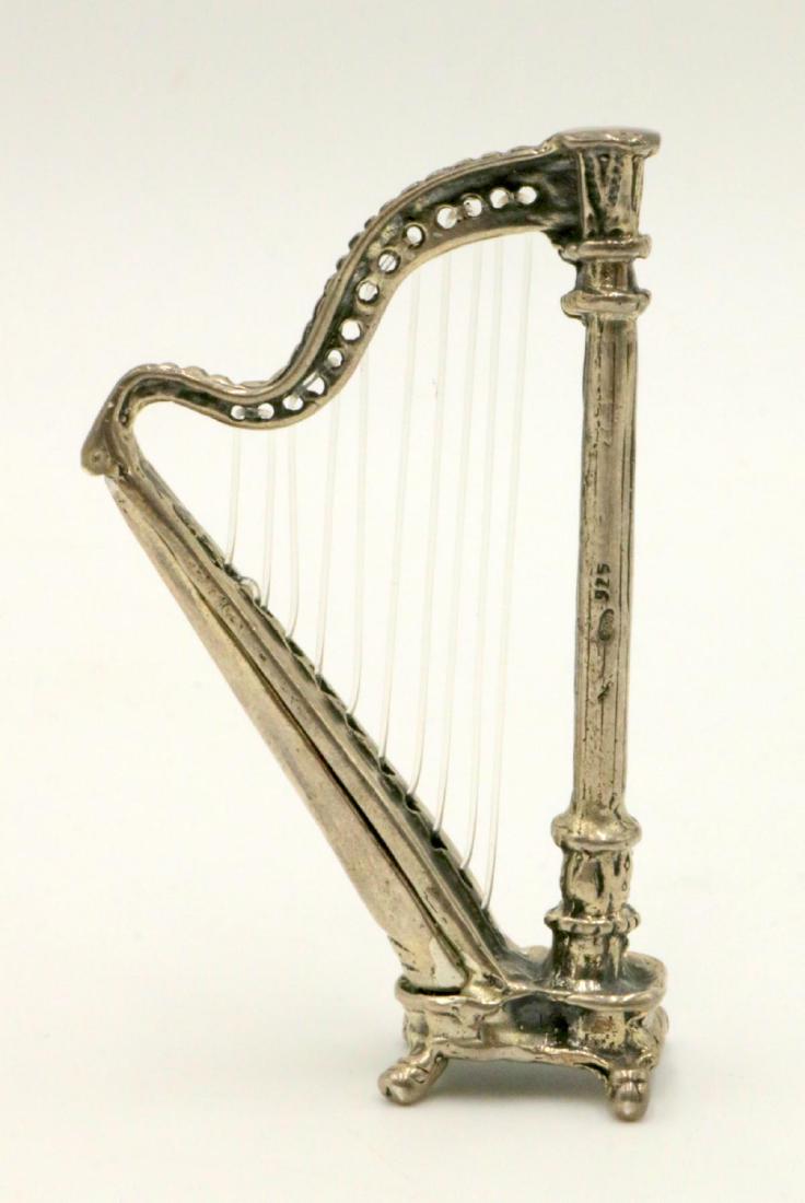 Miniature Sterling Silver Harp: Miniature Sterling Silver Harp. Measures - 2 5/8" high. Weight - 26.4 grams.