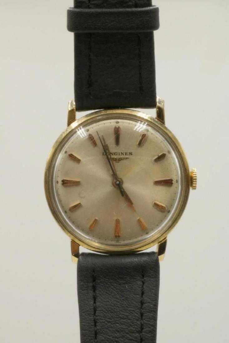 Longines 10Kt Gold Filled Men's Watch: Longines 10Kt Yellow Gold Filled Men's Watch. With black leather band. Measures - 9" long.