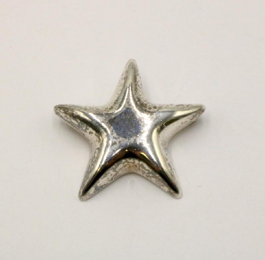 Tiffany & Co. Sterling Silver Star Pin: Tiffany & Co. Sterling Silver Star Pin. Measures - 1 1/2" wide. Weight - 8.9 grams.