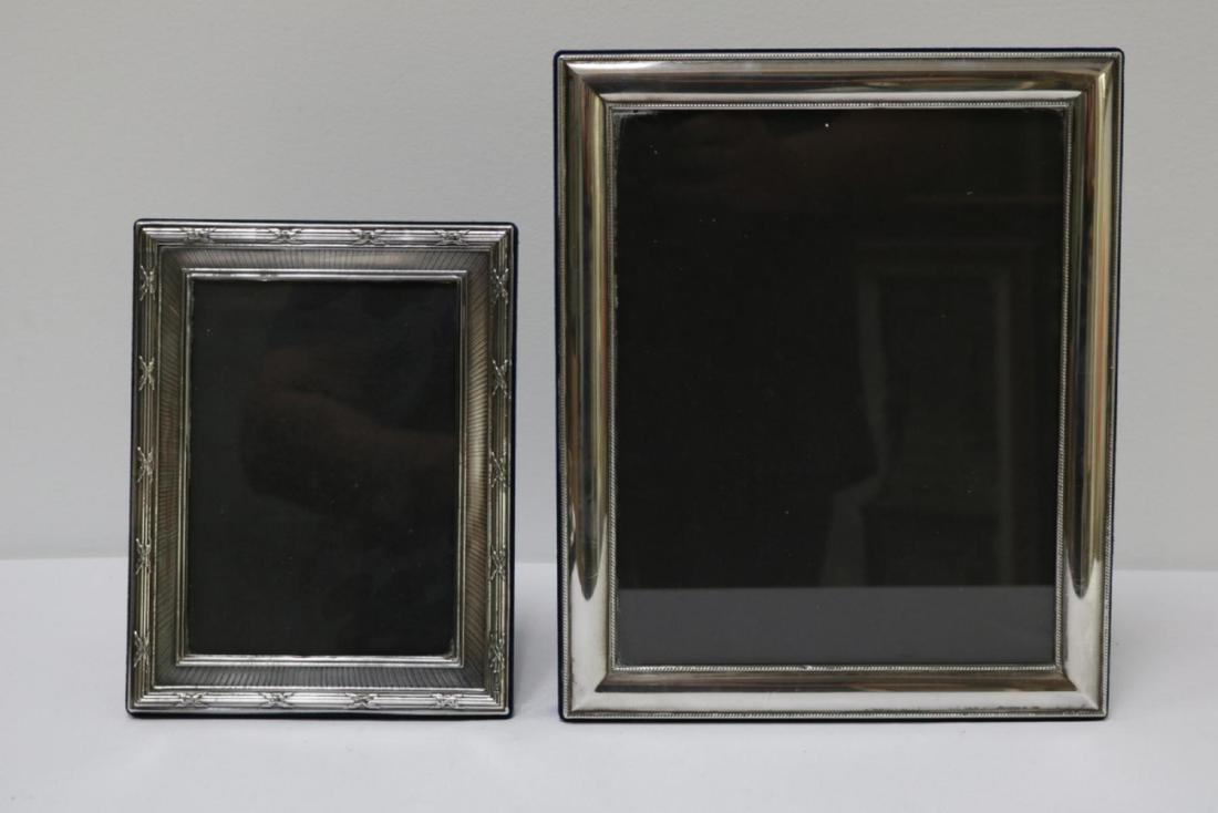 Two Sterling Silver Frames: Two Sterling Silver Frames. Measures - 6 7/8" wide x 8 3/4" wide (picture - 4 3/4" wide x 6 5/8" high), 11 3/4" high x 9 7/8" wide (picture - 7 3/4" wide x 9 3/4" high).
