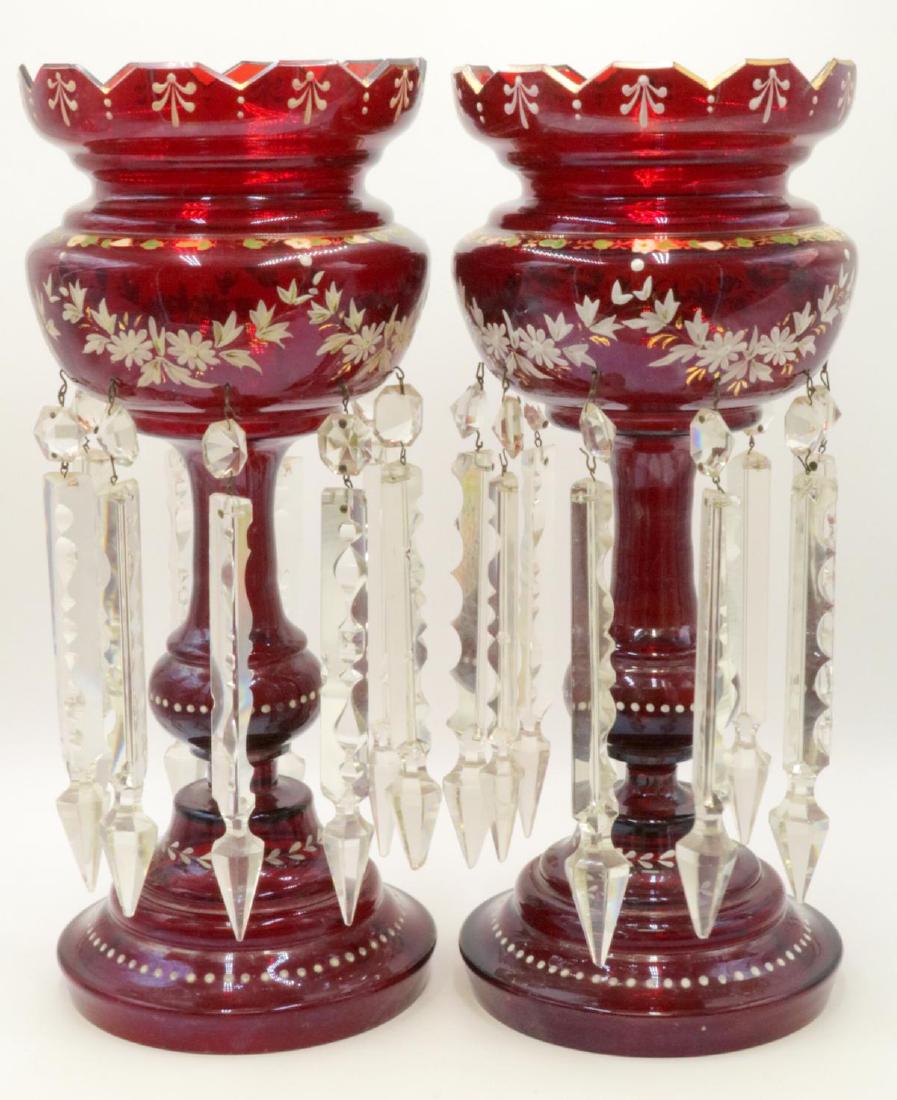 Bohemian Cranberry Glass Mantle Lusters: Bohemian Hand Painted Cranberry Glass Mantle Lusters. Measures - 15" high x 6 3/4" wide. One hanging crystal is broken near tip. One hanging crystal is smaller than the others.