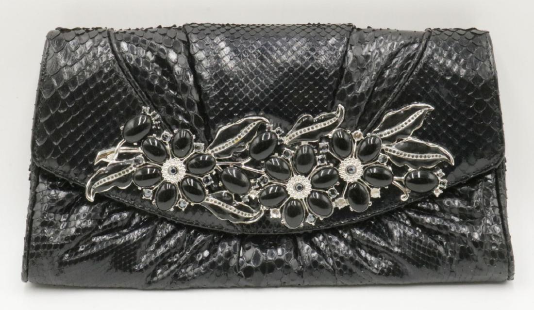 Judith Leiber Black Snake Skin Clutch: Judith Leiber Black Snake Skin Floral Clutch. Measures - 10 1/4" long x 5 3/4" high.