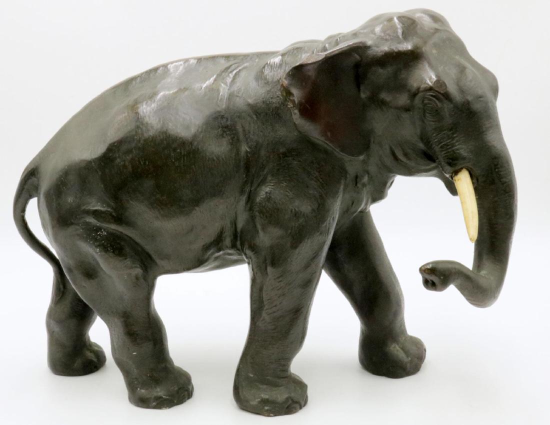 Antique Japanese Elephant Bronze Sculpture: Antique Japanese Elephant Bronze Sculpture, with bone tusks. Signed on bottom. Measures - 10 1/4" high x 13" long x 5" deep.