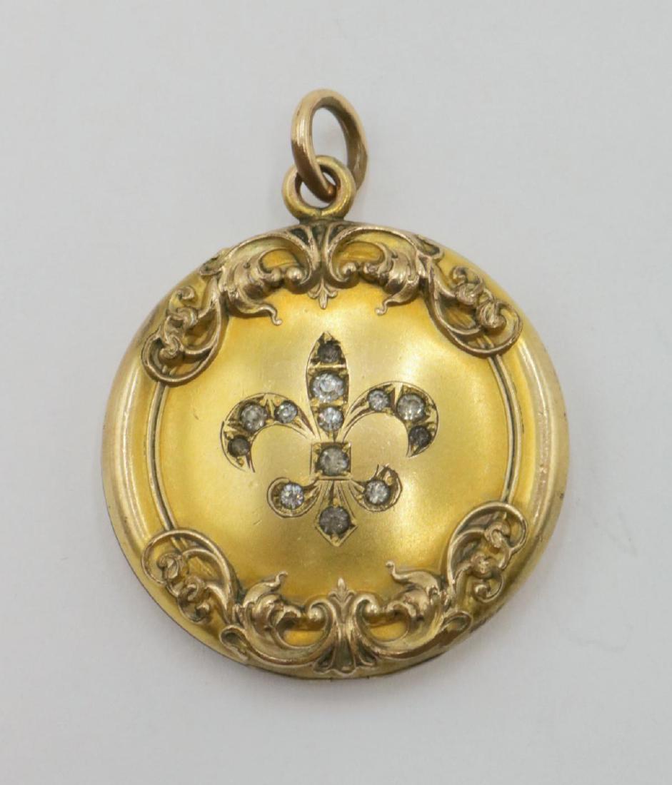 W&K Co. Gold Plated Picture Pendant: Antique W&K Co. Gold Plated Picture Pendant. Depicting a Fleur de Lys. Measures - 1 5/8" long.