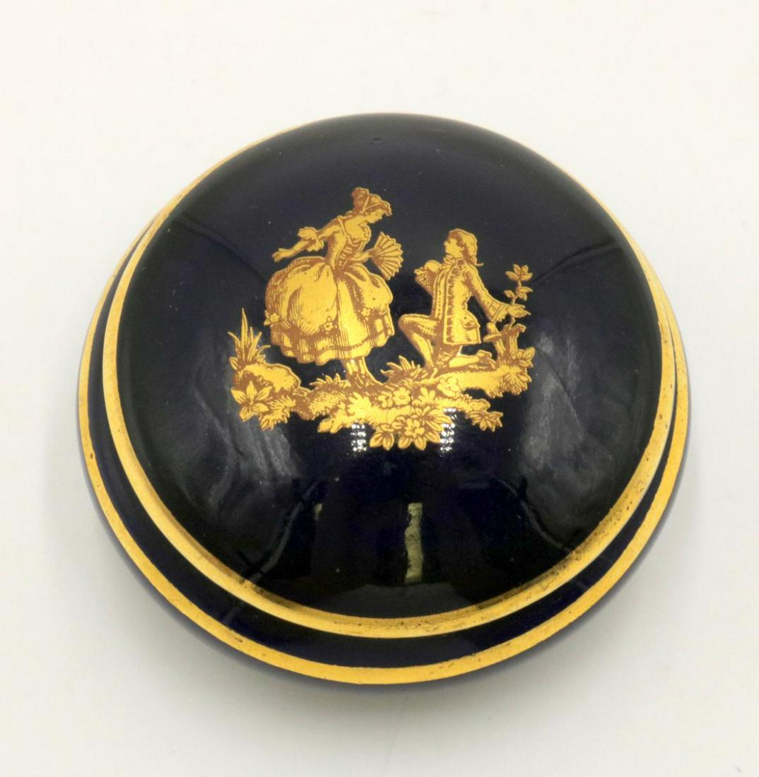 Limoges Dark Blue Porcelain Pill Box: Limoges Dark Blue Porcelain Pill Box. Measures - 2 1/8" wide.