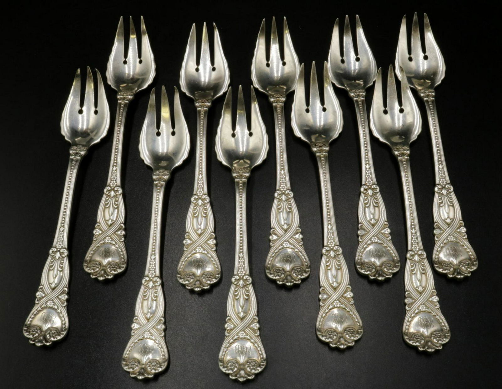 10 Pc. Tiffany & Co. "St. James" Sterling Pastry Forks: 10 Pc. Tiffany & Co. "St. James" Sterling Silver Pastry Forks. Makers Mark "T" (Charles L. Tiffany, 1892-1902). Measures - 6 1/2" long. Weight - 17.31 troy oz. Monogrammed.