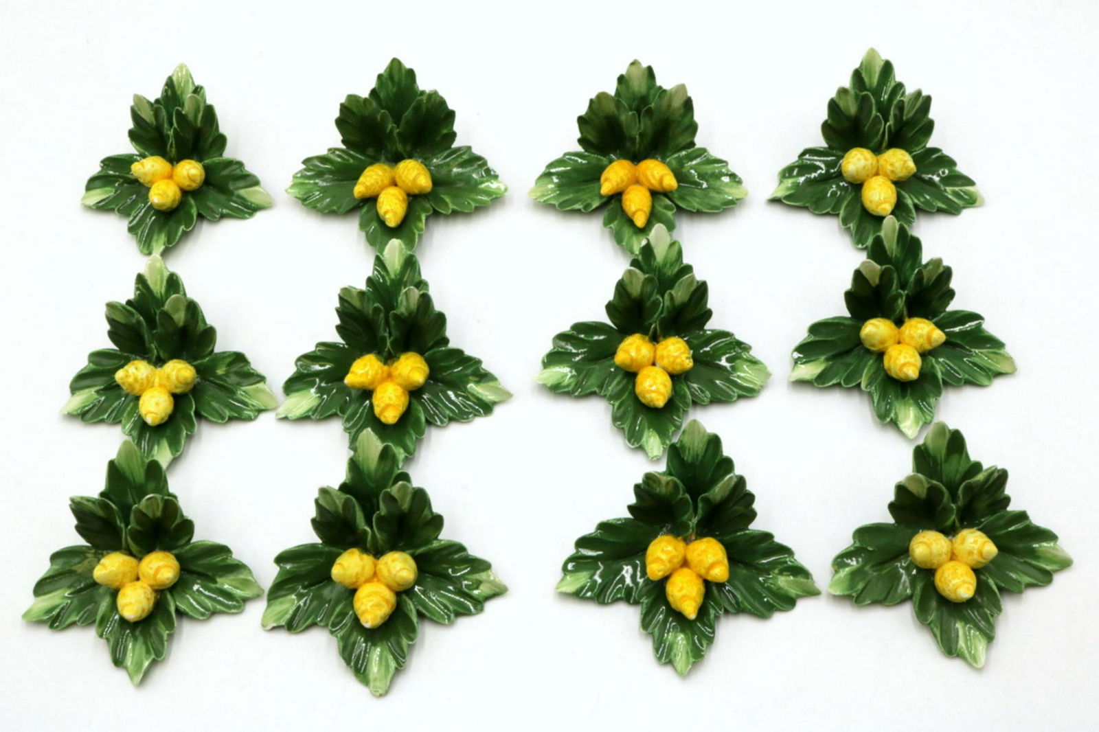 12 Pc. Capodimonte Porcelain Floral Place Card Holders: 12 Pc. Capodimonte Porcelain Floral Place Card Holders. Measures - 3" wide.