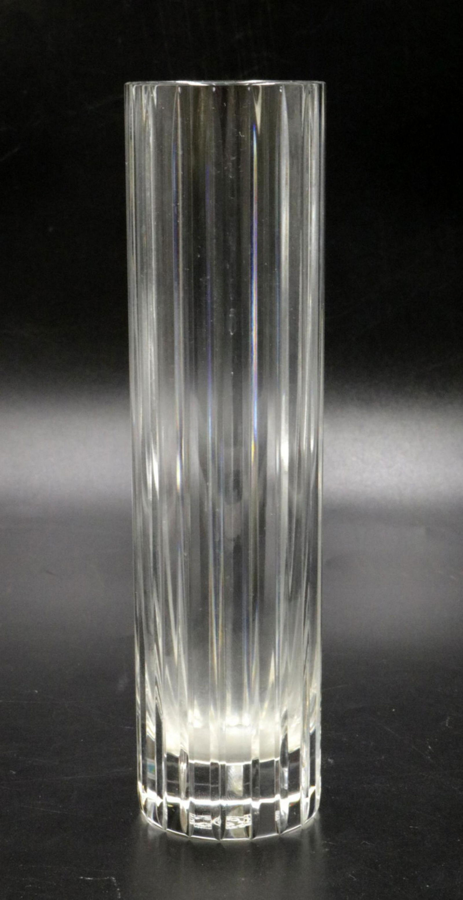 Baccarat "Harmonie" Crystal Vase: Baccarat "Harmonie" Crystal Fluted Vase. Measures - 7" high x 1 3/4" diameter. The Baccarat clear crystal “Harmonie” vase has a marvelously linear silhouette that would be ideal for household. Con