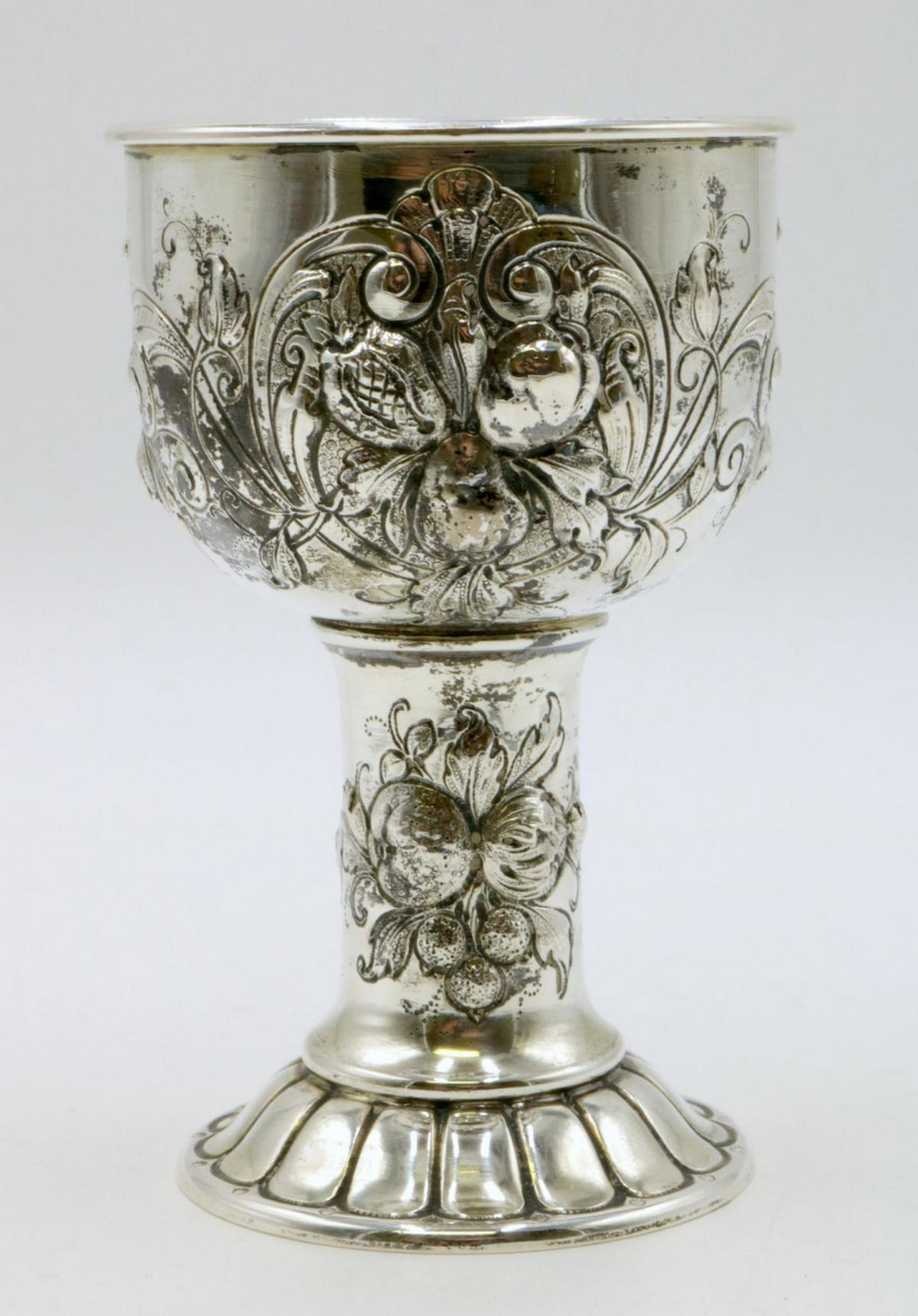 Beautiful Sterling Silver Chalice: Beautiful Sterling Silver Chalice, with high relief floral design. Measures - 5" high x 3 1/8" diameter. Weight - 5 troy oz.