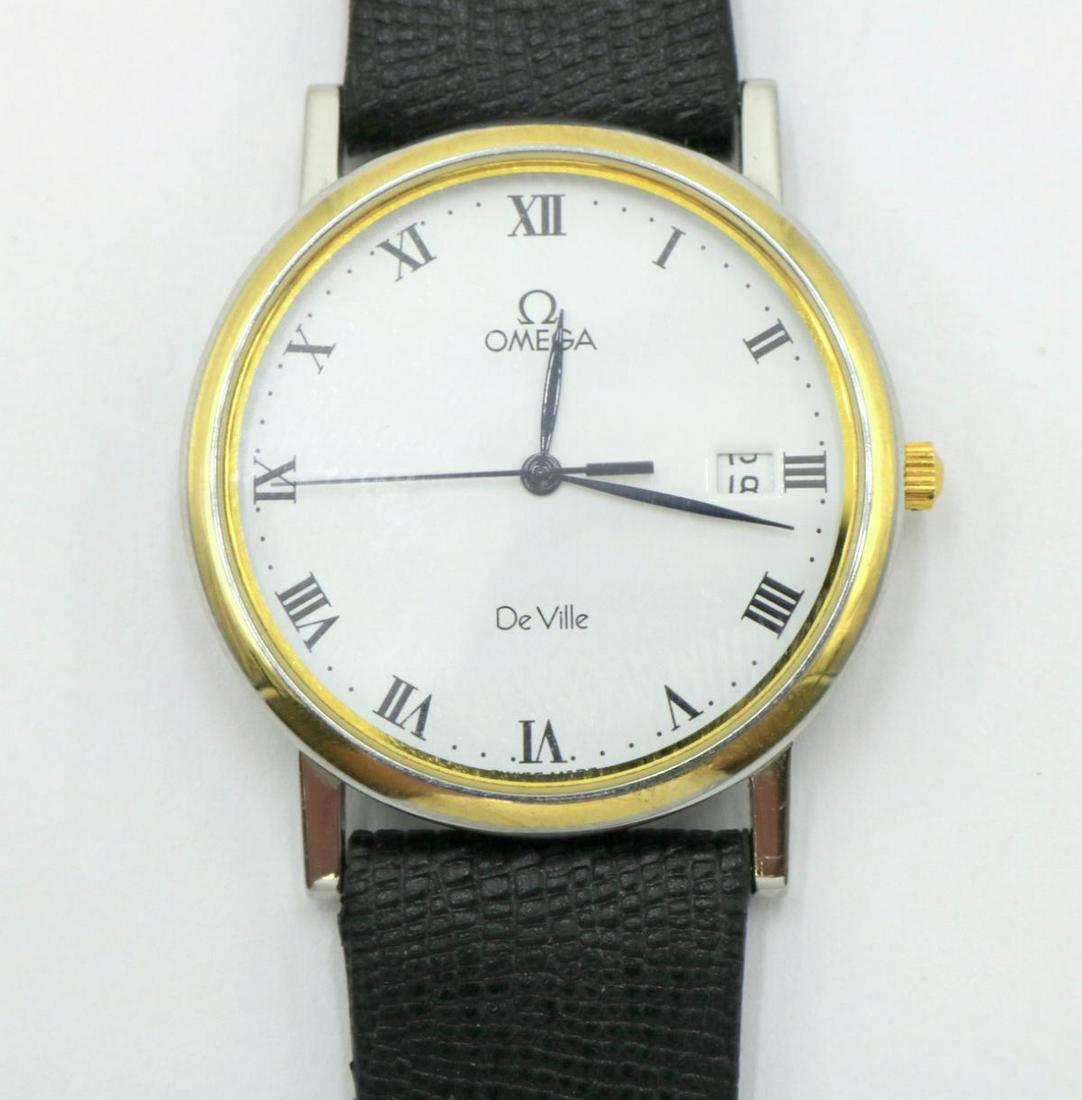Omega "De Ville" 18Kt & Stainless Steel Watch: Omega "De Ville" 18Kt Yellow Gold & Stainless Steel Watch. With black leather band. Measures - 9 1/4" long. #54162186.