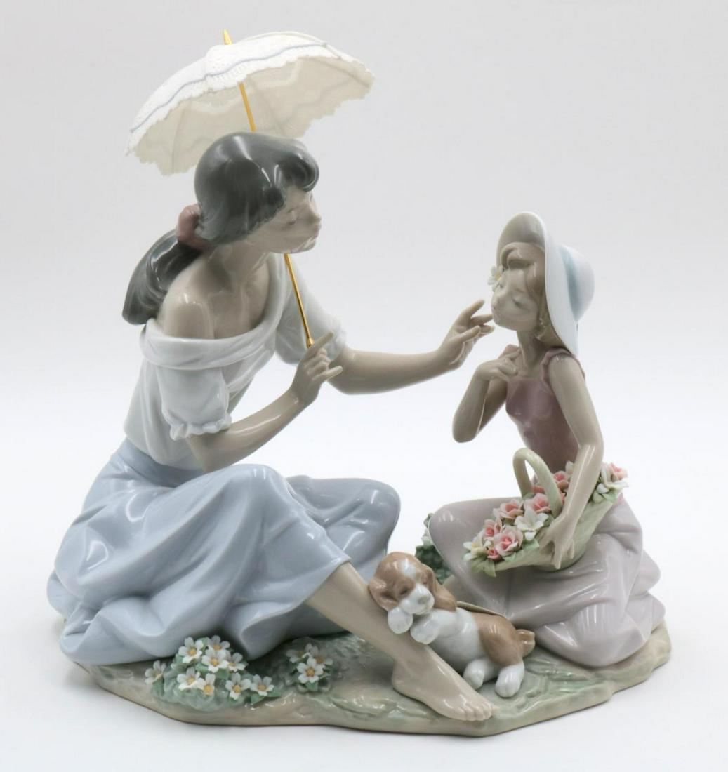 Lladro "As Pretty As A Flower" #6910 Porcelain Group: Lladro "As Pretty As A Flower" #6910 Porcelain Group. A heart-warming scene between two sisters that speaks of closeness, affection and sisterly love in the pastoral and romantic setting of the Lladr�