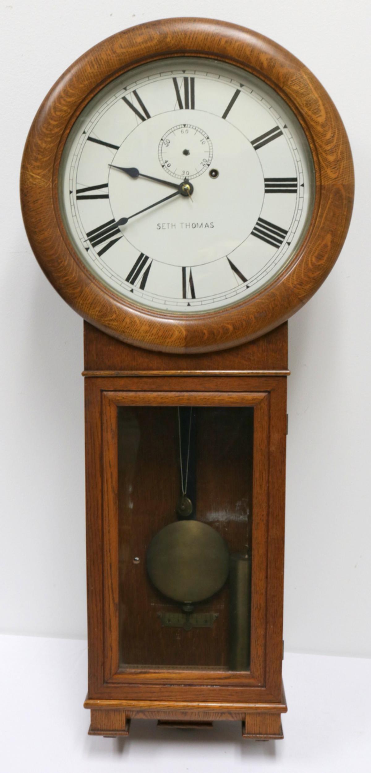 Antique Seth Thomas Wooden Wall Clock: Antique Seth Thomas Wooden Wall Clock. Measures - 38" high x 16" wide.