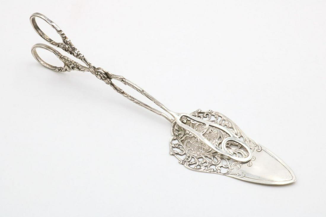 Italian 800 Silver Pierced Tongs: Italian 800 Silver Pierced Tongs. Measures - 9 1/4" long. Weight - 78 grams.