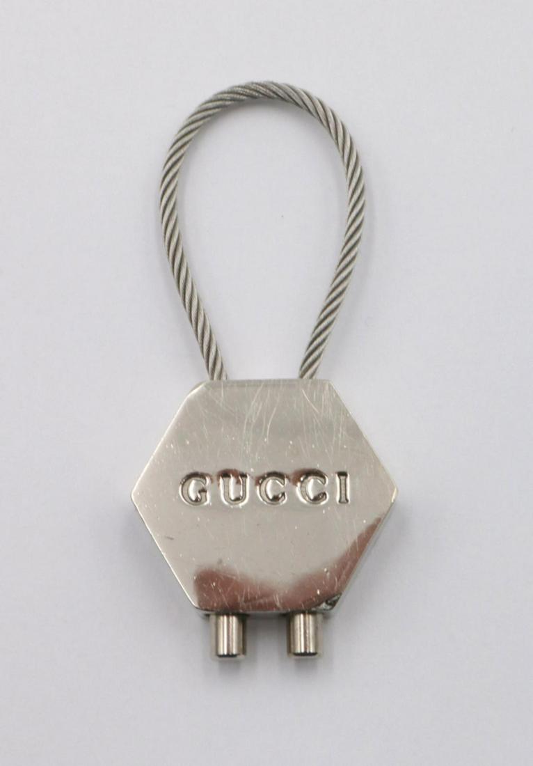 Gucci Silver Tone Key Chain: Gucci Silver Tone Key Chain. Measures - 2 3/4" long.