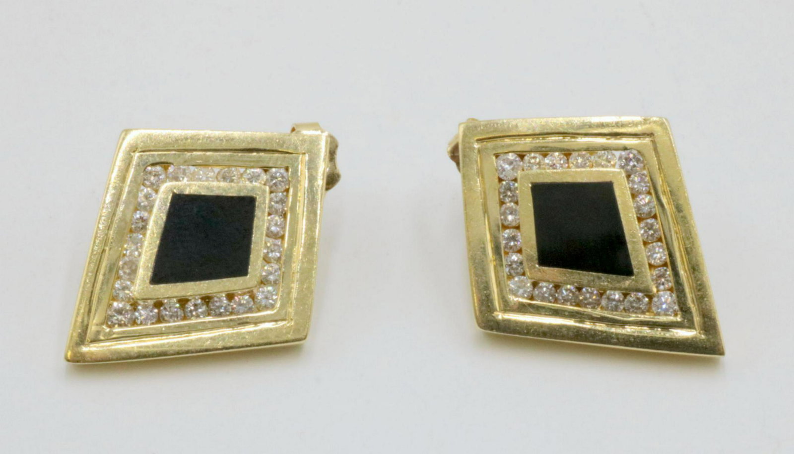 14Kt Black Onyx & Diamond Earrings: 14Kt Yellow Gold Black Onyx & Diamond Earrings. Measures - 1 1/8" high. Weight - 5.9 dwt.