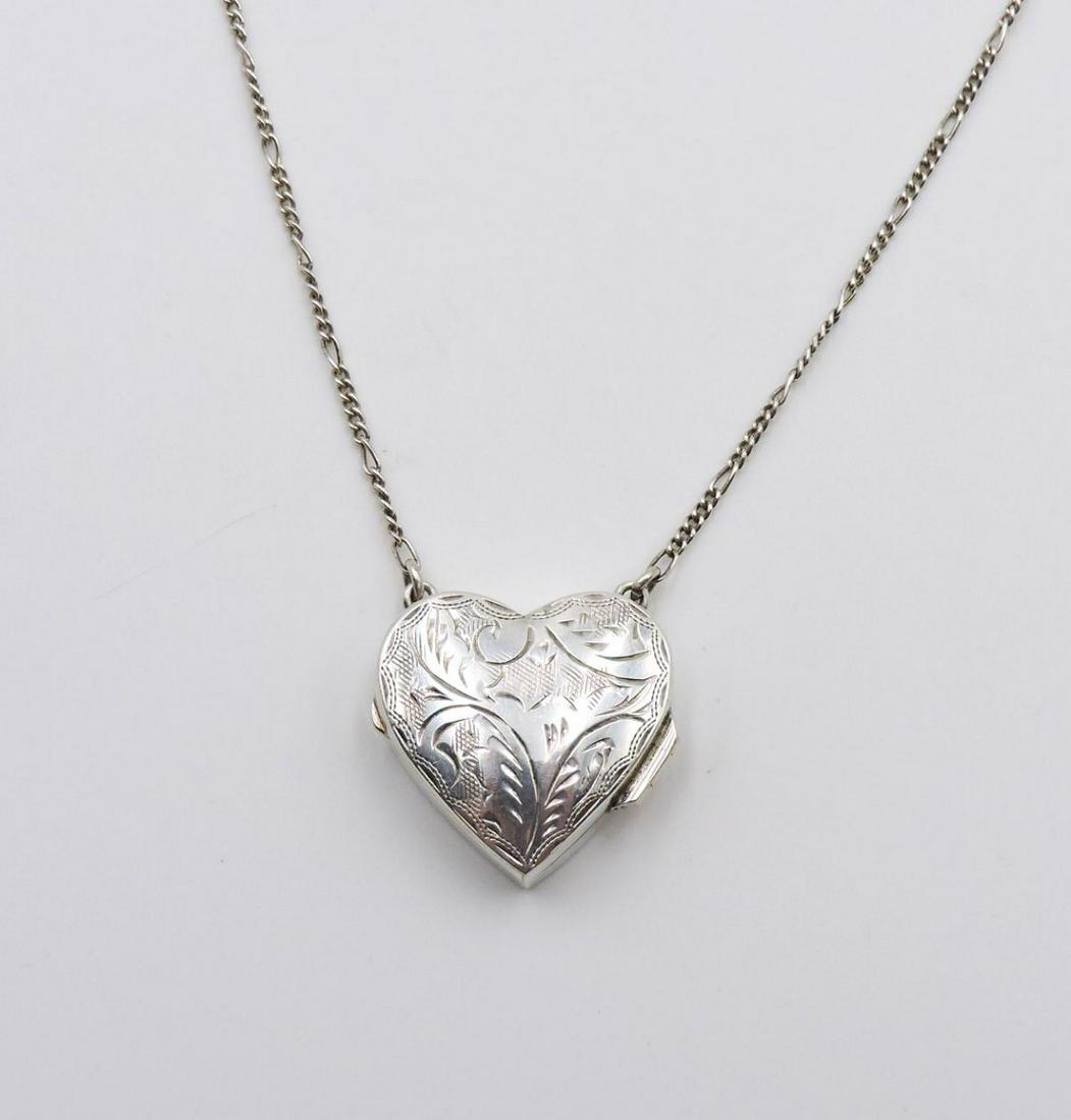 Sterling Silver Heart Locket w/ Necklace: Sterling Silver Heart Locket w/ Necklace. Measures - 26" long. Weight - 8.9 grams.