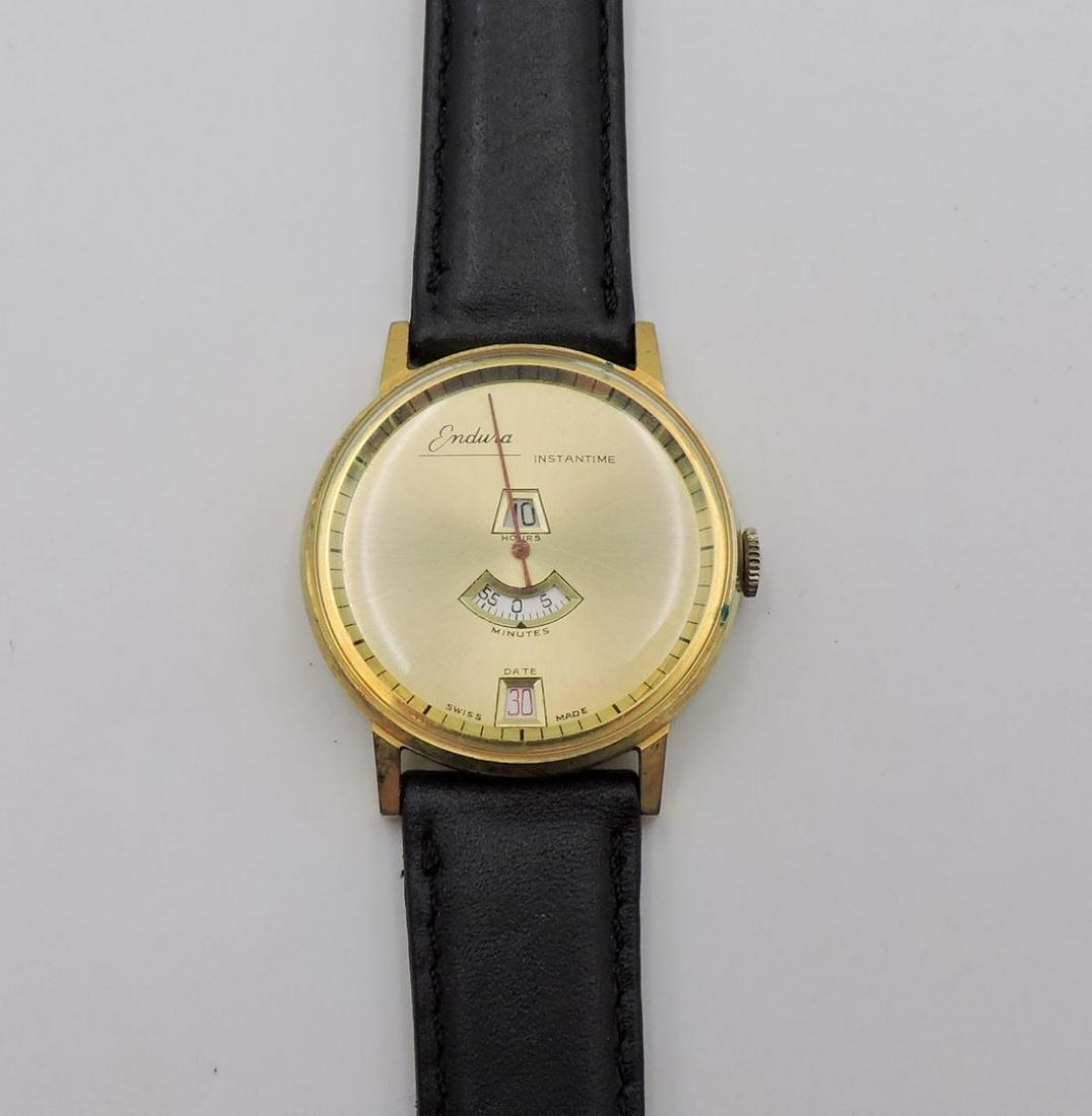 Endura "Jump Hour" Swiss Watch: Endura "Jump Hour" Swiss Watch. With leather band. Measures - 10" long.