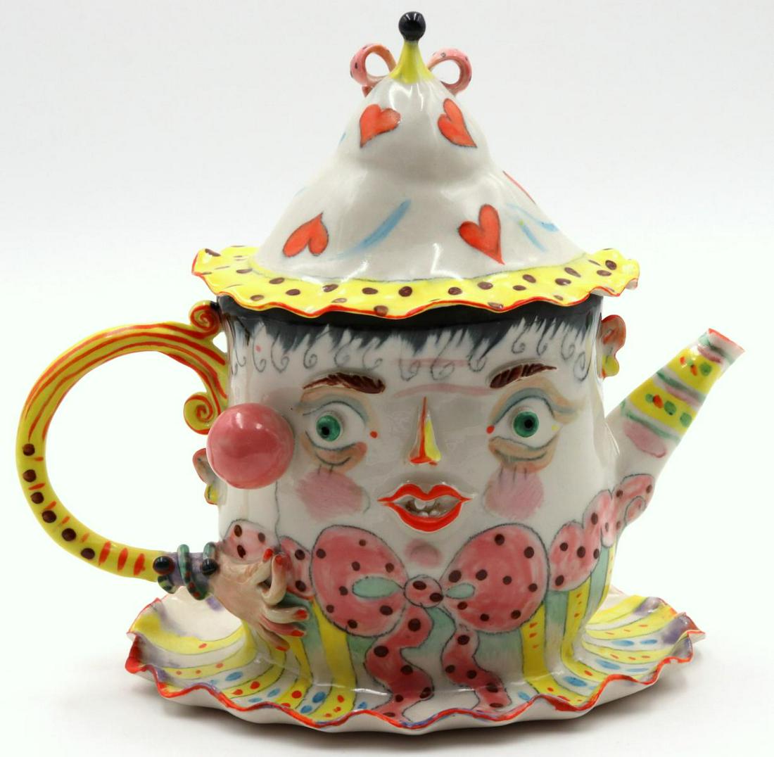 Irina Zaytceva (Russian, b. 1937) Porcelain Creamer: Rare Irina Zaytceva (Russian, b. 1937) Hand Painted Porcelain Whimsical Creamer. Depicting grotesque face with hat. Measures - 8" high x 8" wide. Irena Zaytceva is known for pinched porcelain works th