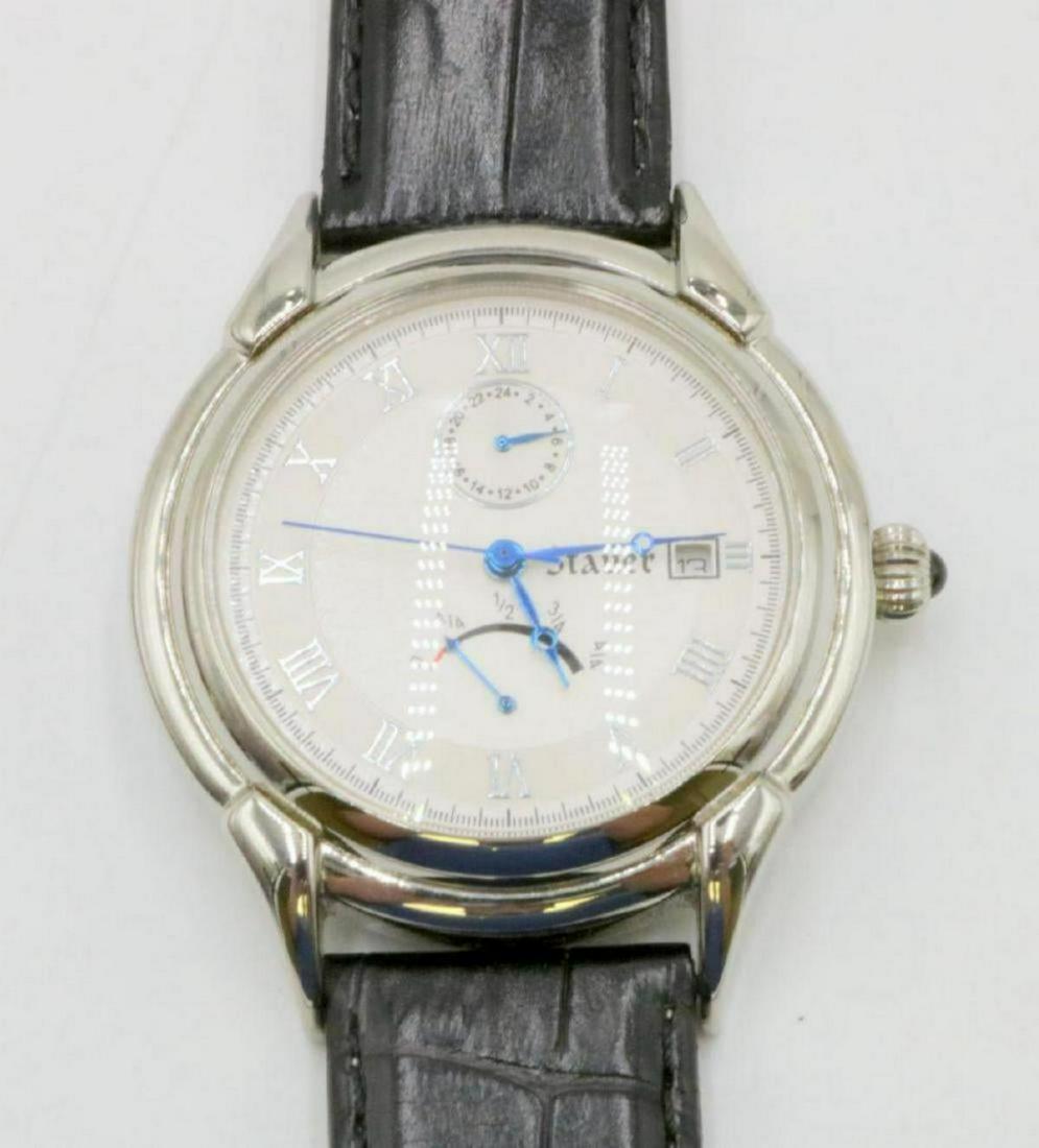 Stauer Stainless & Leather Band Watch: Stauer Stainless Steel & Leather Band Power Reserve Watch. 21 jewels, automatic. 24 hour time indicator and power reserve indicator. With original box. Measures - 9 3/4" long.