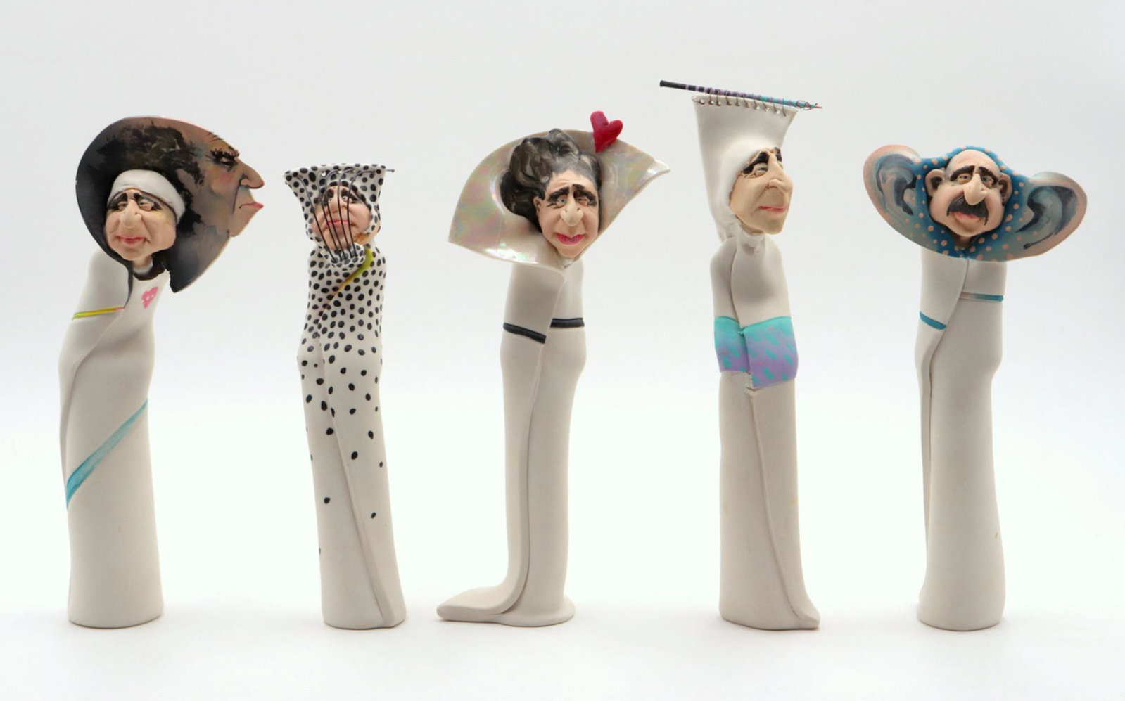 5 Pc. Signed Pottery Salt & Pepper Shakers: 5 Pc. Signed Pottery Salt & Pepper Folk Art Sculptures. Measures - 8 1/2" - 9 1/4" high.