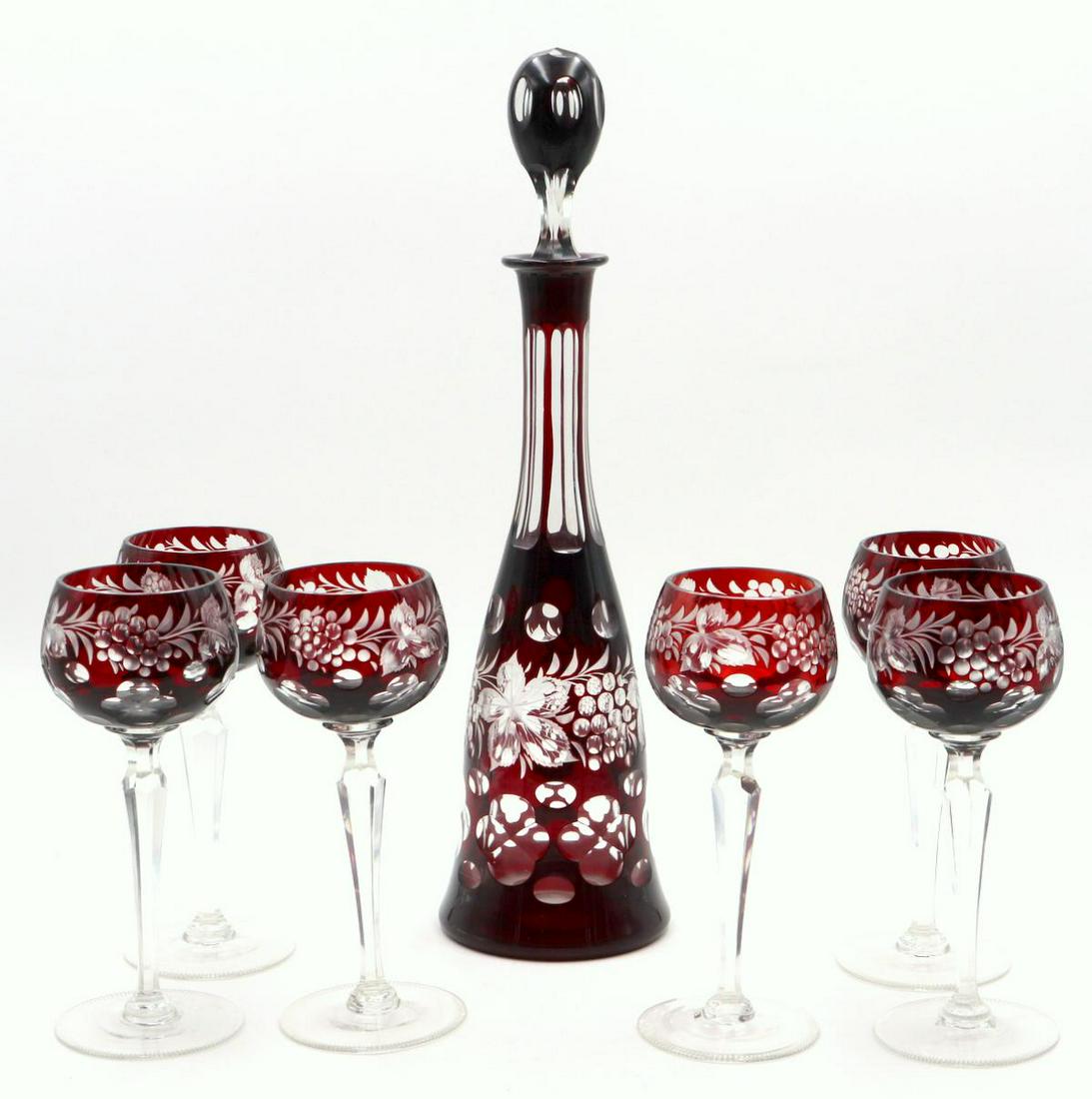 Bohemian Cut Crystal Decanter Set: 7 Pc. Bohemian Cut Crystal Decanter Set. Ruby & clear color crystal. Measures approx. - decanter - 17 1/4" high, 6 wine glasses - 8" high.