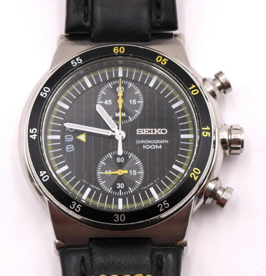 Seiko 7T94 Chronograph Watch: Seiko 7T94 Chronograph Watch. With black leather band. Measures approx. - 10" long.