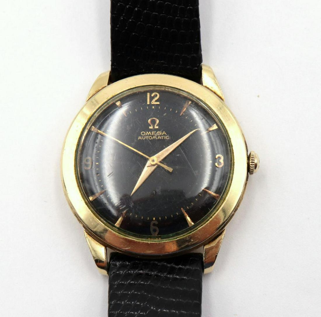 Vintage Omega 14Kt Gold Filled Watch: Vintage Omega 14Kt Gold Filled Watch. With black leather band. Measures - 9" long.