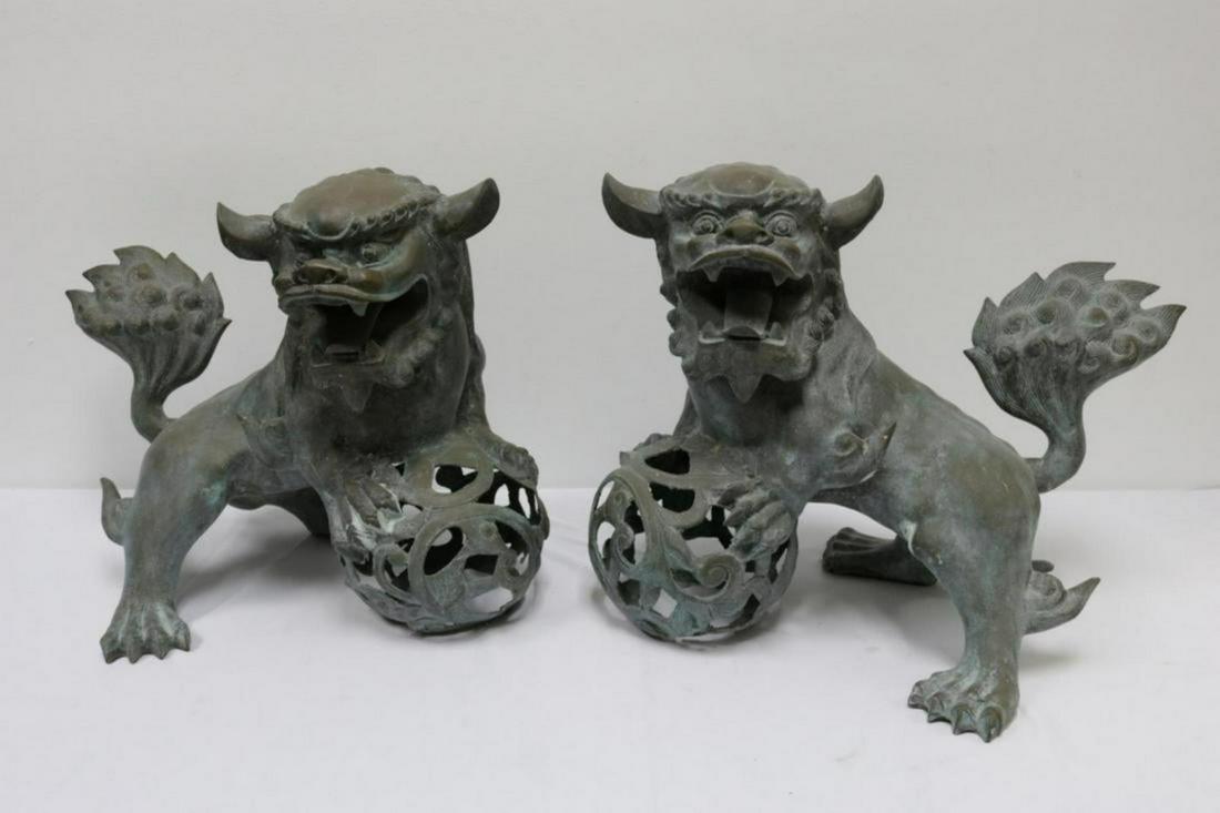 Pair of Chinese Bronze Foo Dogs: Pair of Heavy Chinese Bronze Foo (Fu) Dogs. Measures - 18" high x 22" wide.
