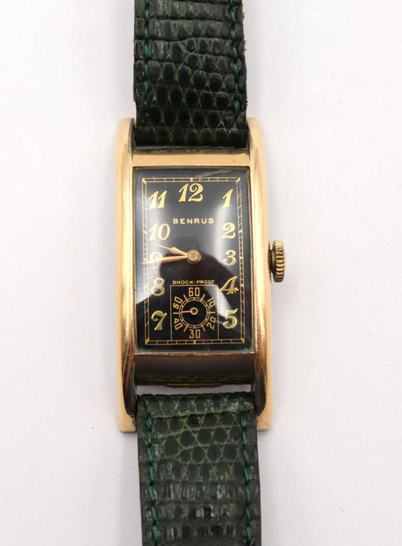 1930's Benrus Gold Filled Watch: Vintage 1930's Benrus Gold Filled Watch. Long curvex wrist watch, 17 jewels, ac 8 movement, black dial with gold numbers. Measures approx. - 9" long.