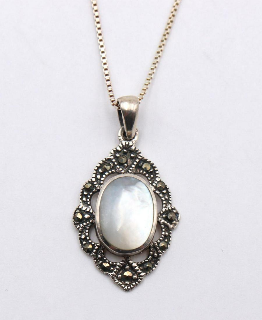 Sterling MOP & Marcasite Pendant w/ Necklace: Sterling Silver Mother of Pearl & Marcasite Pendant w/ Necklace. Measures approx. - 17" long. Weight - 4.2 grams.