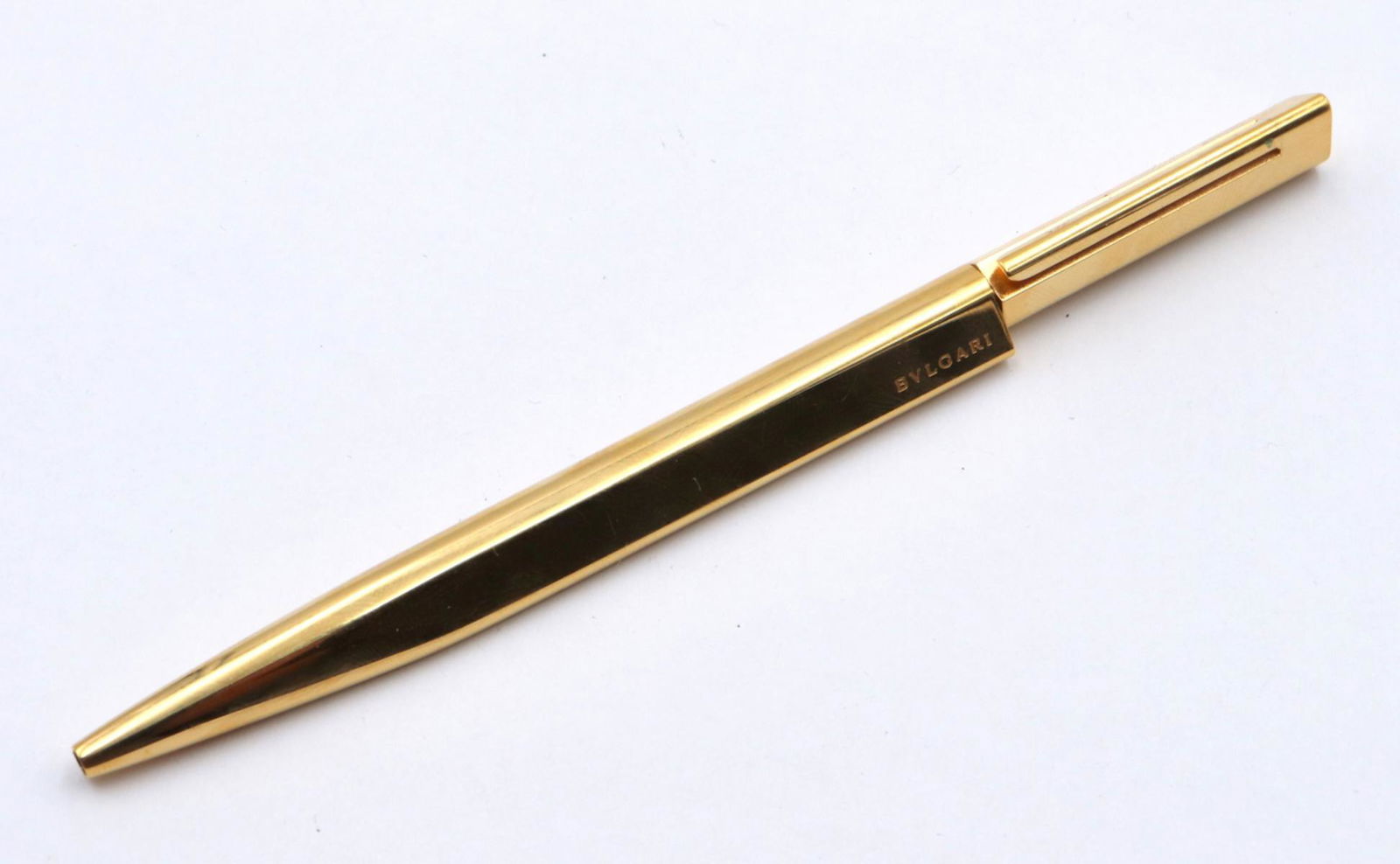 Vintage Bvlgari Gold Plated Ball Point Pen: Vintage Bvlgari Gold Plated Ball Point Pen. With original silver case and box. Measures approx. - 5 1/2" long.