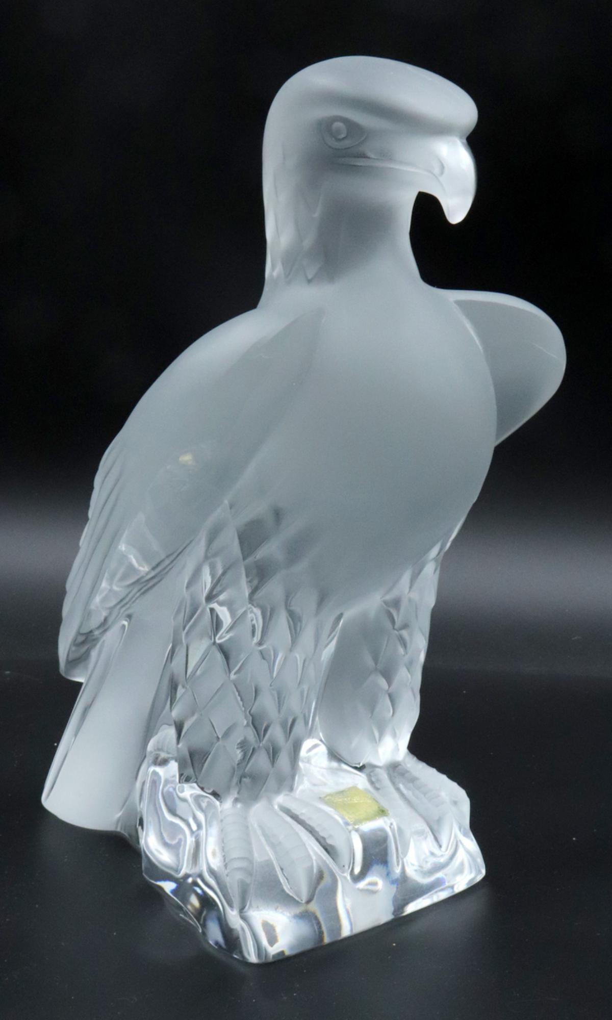 Lalique "Liberty Eagle" Crystal Sculpture: Heavy and Large Lalique "Liberty Eagle" Crystal Sculpture. Measures – 9 ½” high x 6 ½” wide. Approx. 9 pounds. A symbol of liberty, victory and power, this bird of prey with finely chiseled fe
