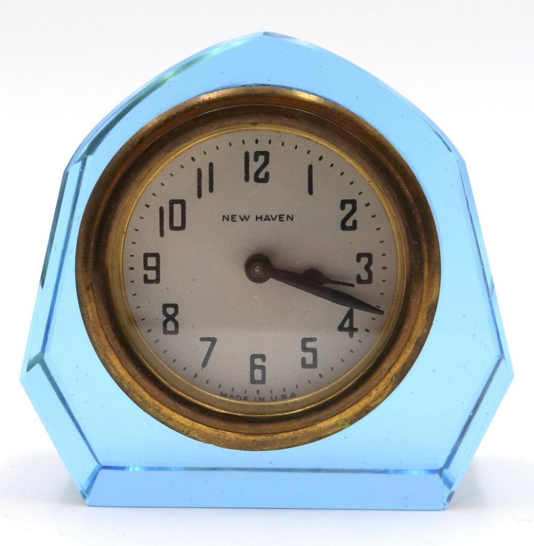 New Haven Blue Glass Skeleton Boudoir Clock: New Haven Blue Glass Skeleton Boudoir Clock. Measures approx. - 3 1/4" high x 3 3/8" wide.