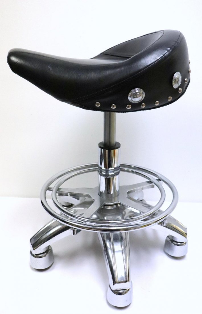 Leather Saddle & Chrome Bar Stool: Black Leather Saddle & Chrome Bar Stool. Measures approx. - 29" high x 21" wide.