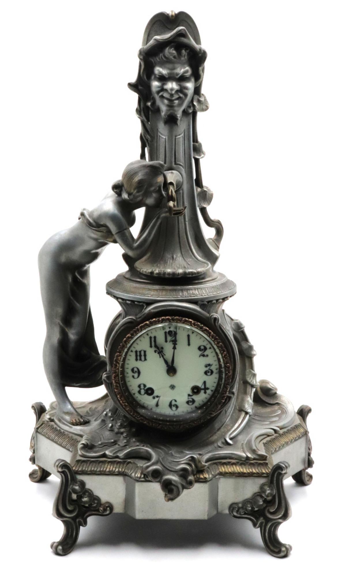 Antique Ansonia Metal Mantel Clock: Antique Ansonia Metal Mantel Clock. Measures approx. - 22 5/8" high x 14" wide.