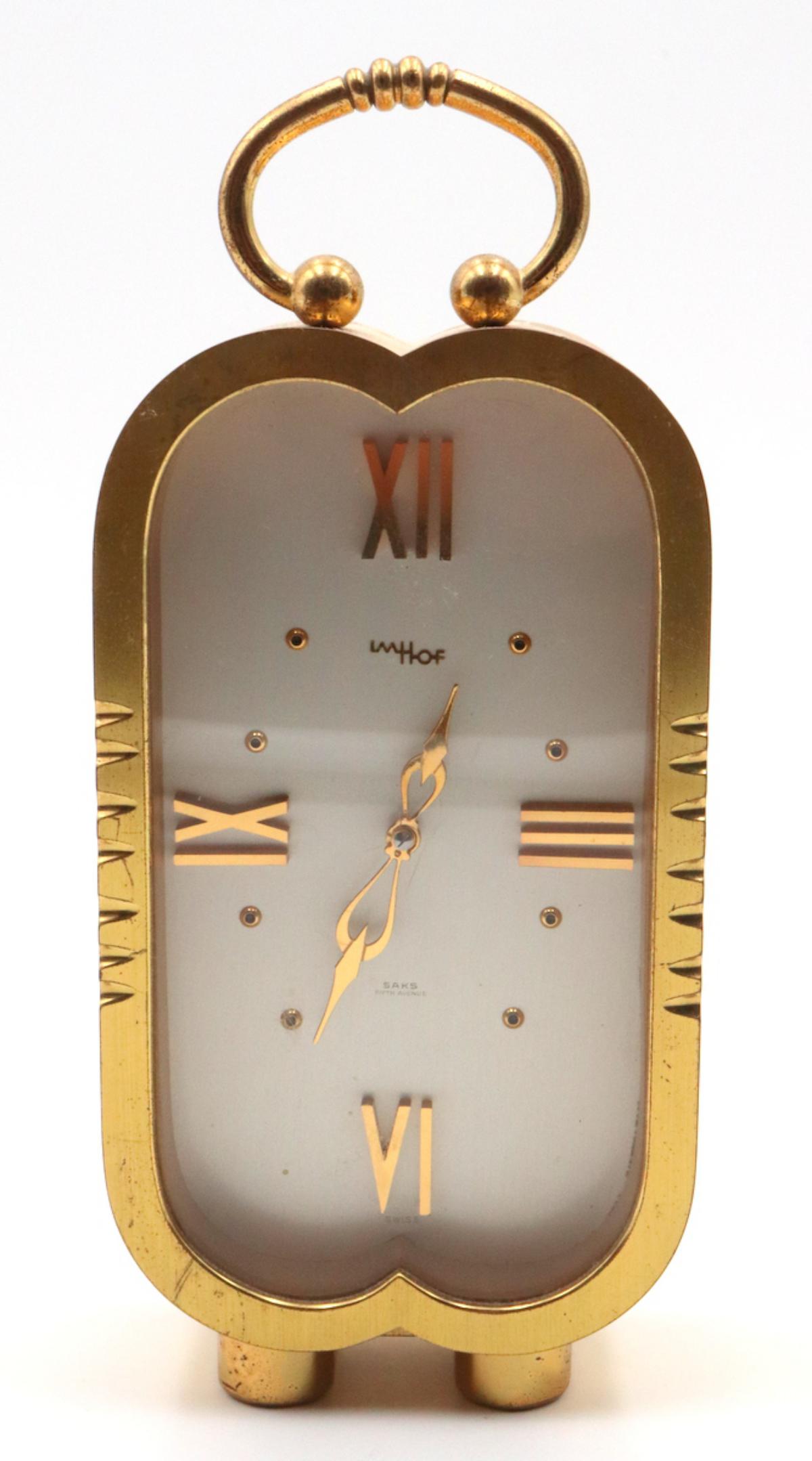 Vintage Imhof Desk Clock: Vintage Imhof Desk Clock. Measures approx. - 7" high x 3 1/8" wide.