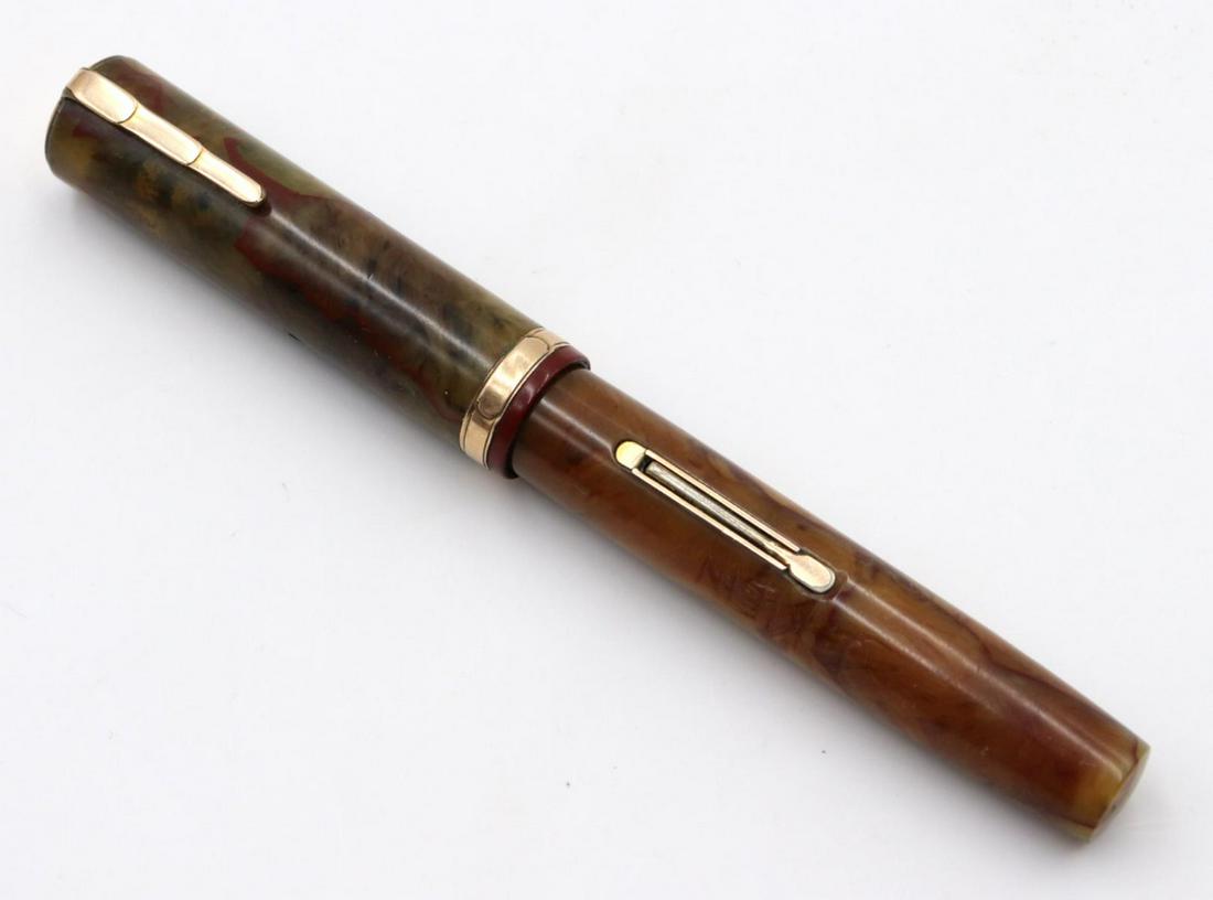 Waterman's "Patricia" Fountain Pen: Rare Waterman's Ideal "Patricia" 1930's Persian Marble Fountain Pen. Measures - 4 1/4" long.