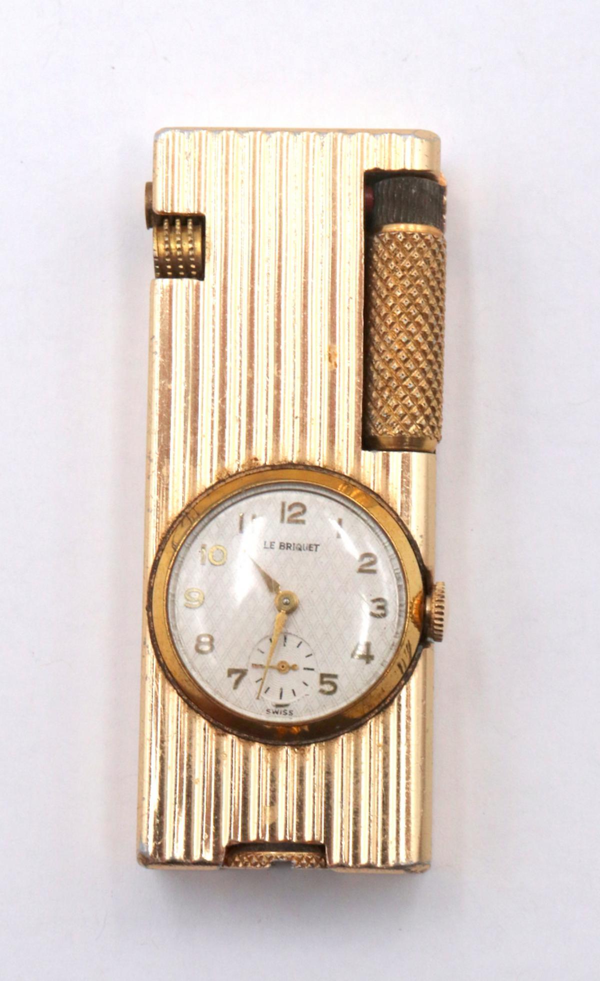Le Briguet Gold Tone Lighter: Le Briguet Gold Tone Lighter. With working swiss mechanical wind up. Subsidary second hand watch.
