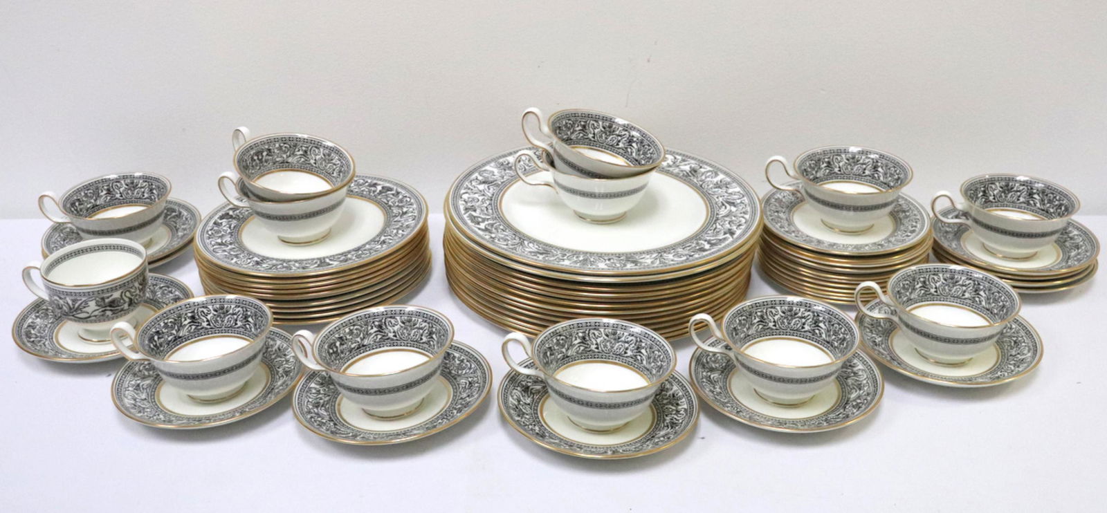 60 Pc. Wedgwood "Black Florentine" China Set: 60 Pc. Wedgwood "Black Florentine" Bone China Set. This set contains 13 dinner plates, 10 salad plates, 12 bread and butter plates, 13 tea cups and 12 saucers.