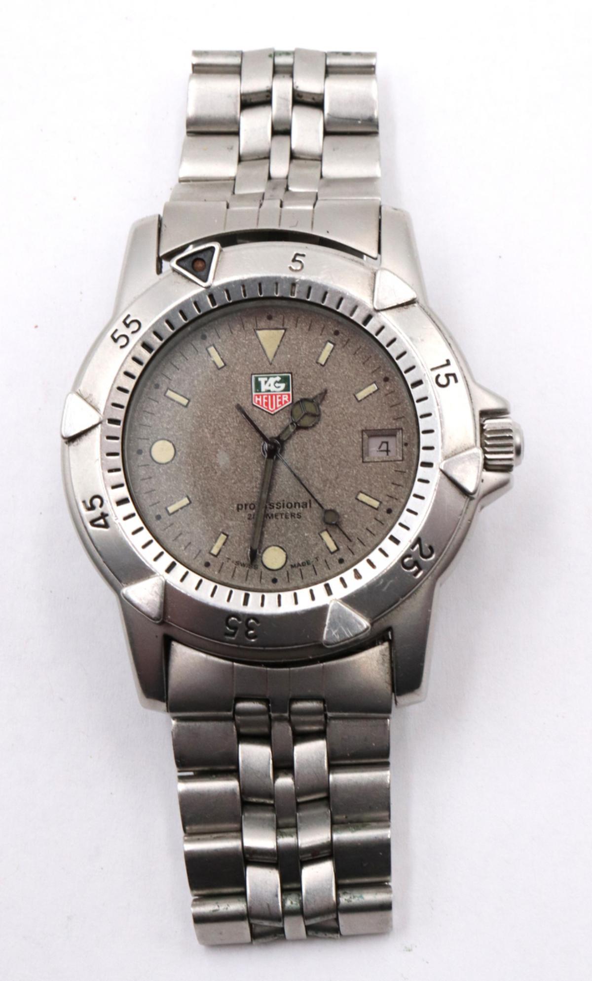 Tag Heuer 1500 Men's Wristwatch: Tag Heuer 1500 Men's Wristwatch. 959.706 Professional 200M, granite dial, original band and crown.