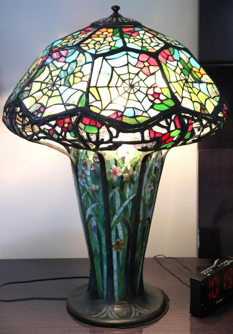 After Tiffany Studios Stained Glass & Bronze Lamp: After Tiffany Studios Stained Glass & Bronze Lamp. Measures approx. - 25 1/2" high x 20" diameter.