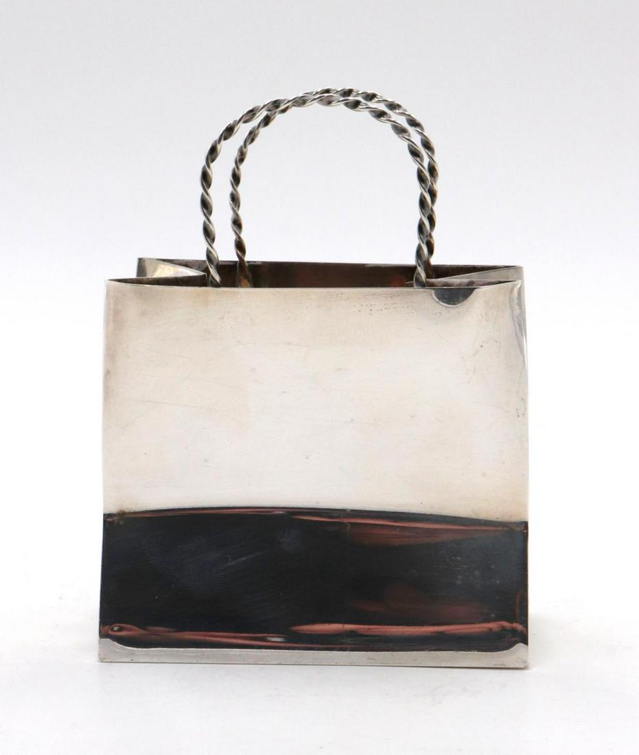 Cartier Sterling Silver Shopping Bag: Cartier Sterling Silver Shopping Bag. Measures approx. - 4 1/4" high x 3" wide. Weight - 2.815 troy oz.