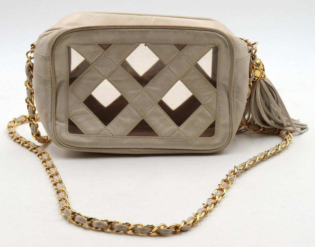 Vintage Chanel Cream Leather Purse: Vintage Chanel Cream Leather Purse. Measures approx. - 5" high x 8" wide.