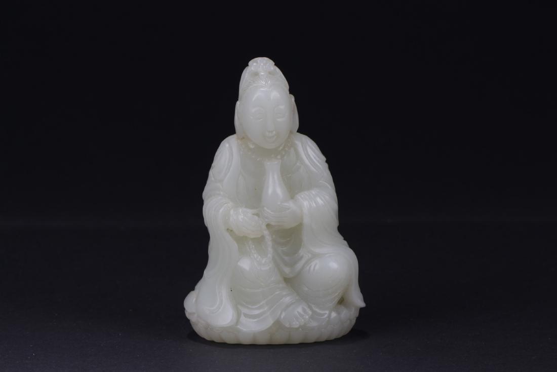 Chinese Jade Figurine: Chinese Jade figurine, simplistic carving of a seated female figure wearing loose robes and holding a medicine urn in creamy white jade. Length 2 in Height 3.25 in