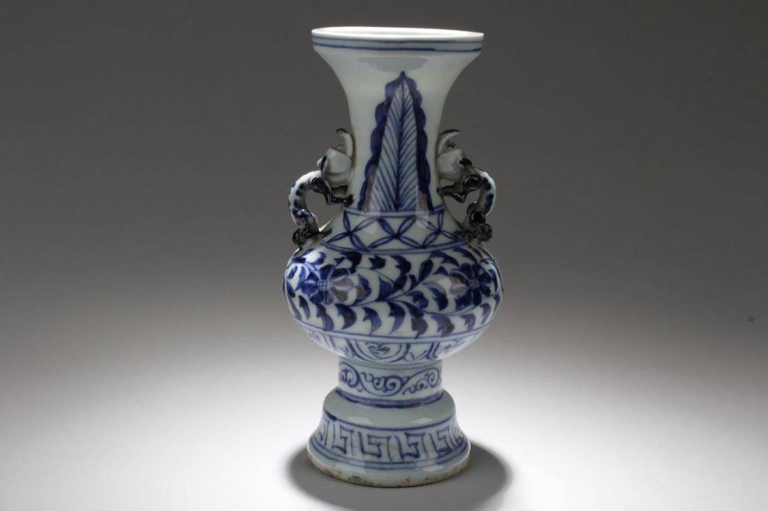 Chinese Blue & White Porcelain Vase: Chinese Blue & White Porcelain Vase, flanked by two mythical faced handles. Height: 7.25 "